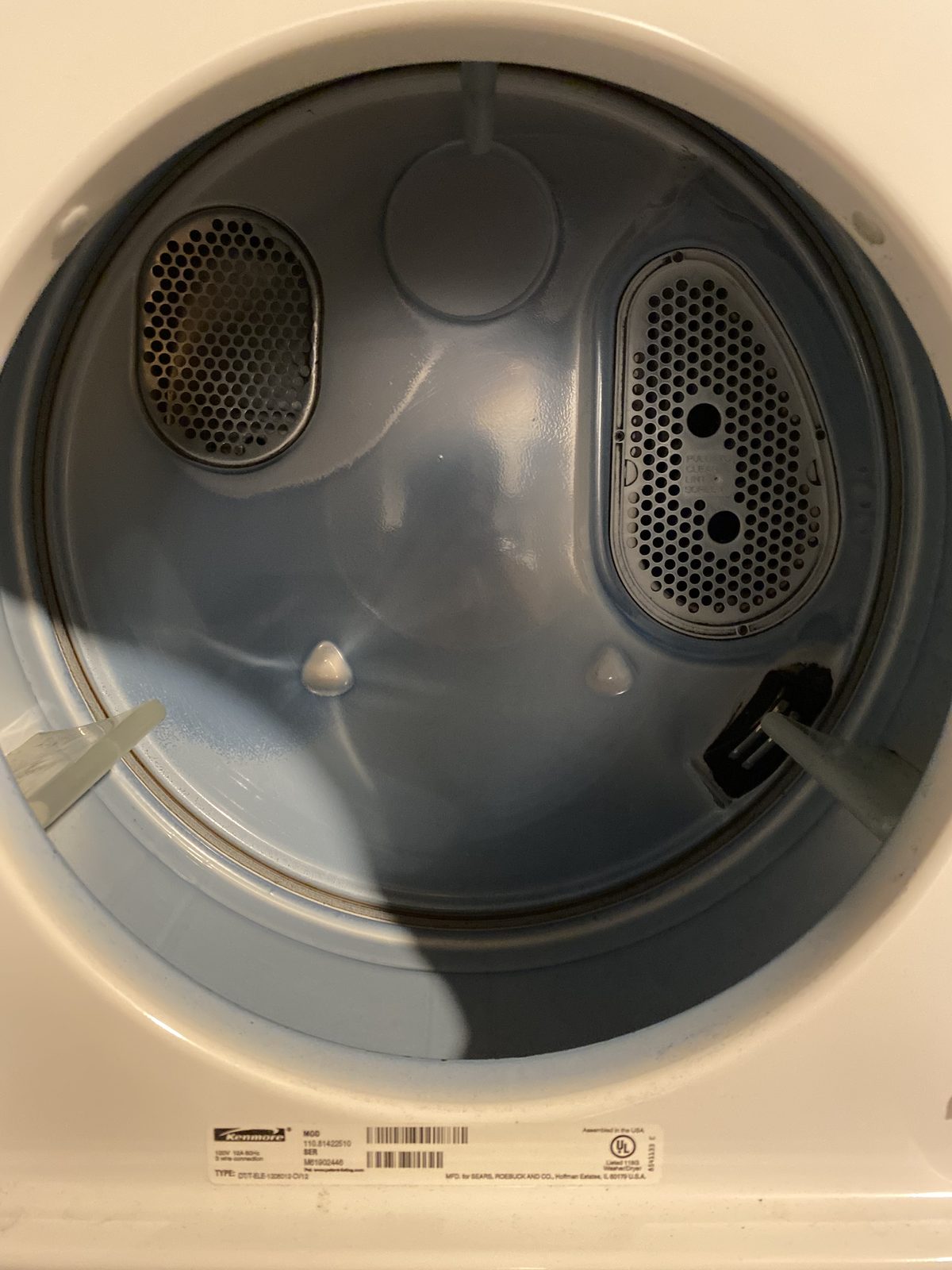 Clean dryer drum with a fresh lint screen on a serviced rental dryer